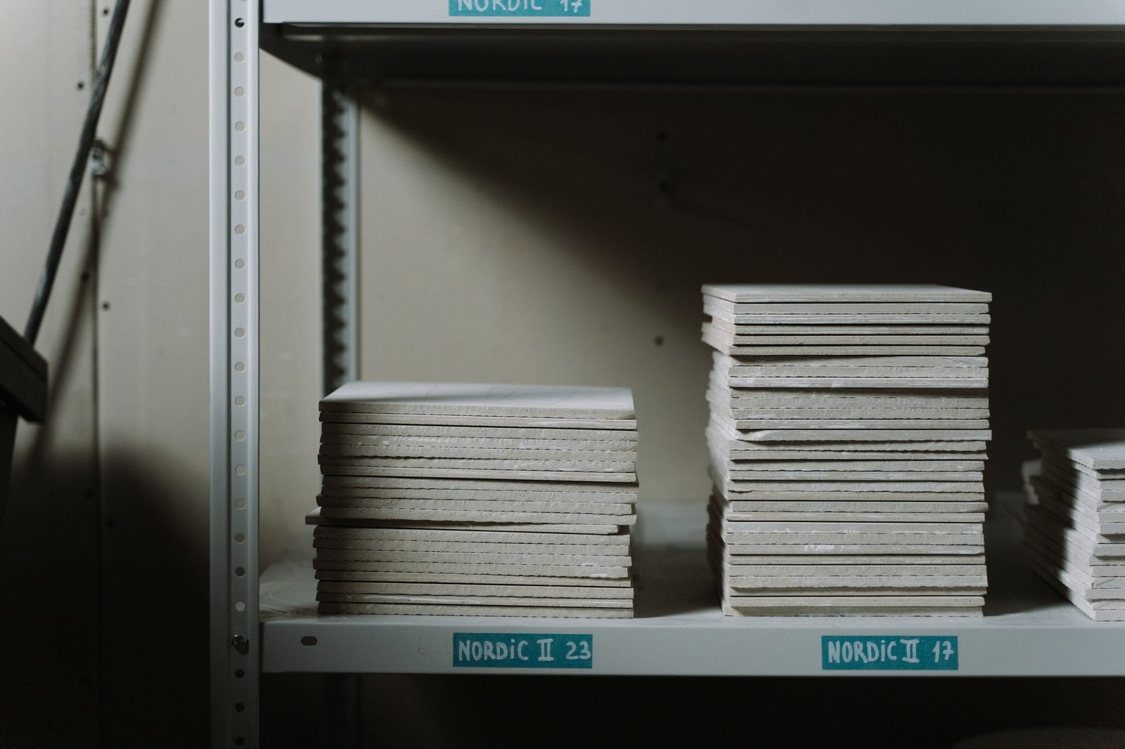 Stacks of ceramic tiles on factory shelves